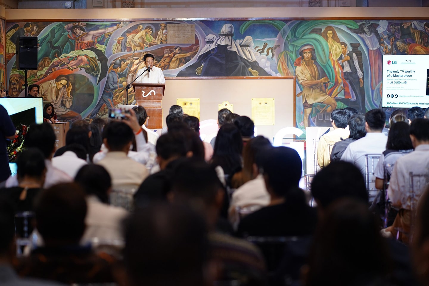 A photo of the presenter and the listening audience at the Old Senate Hall of the Philippines 