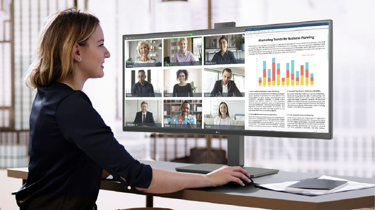 A picture of a woman using the LG ergonomic business monitor