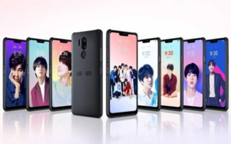A string of the LG G7 ThinQ smartphones attached to the BTS Smart Case display images of BTS members.