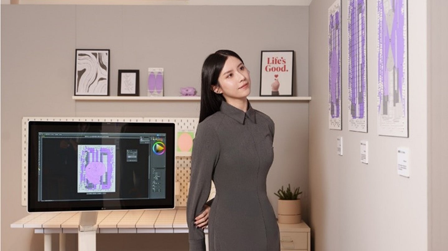 A photo of a woman standing in front of StandbyMe 2 in a room