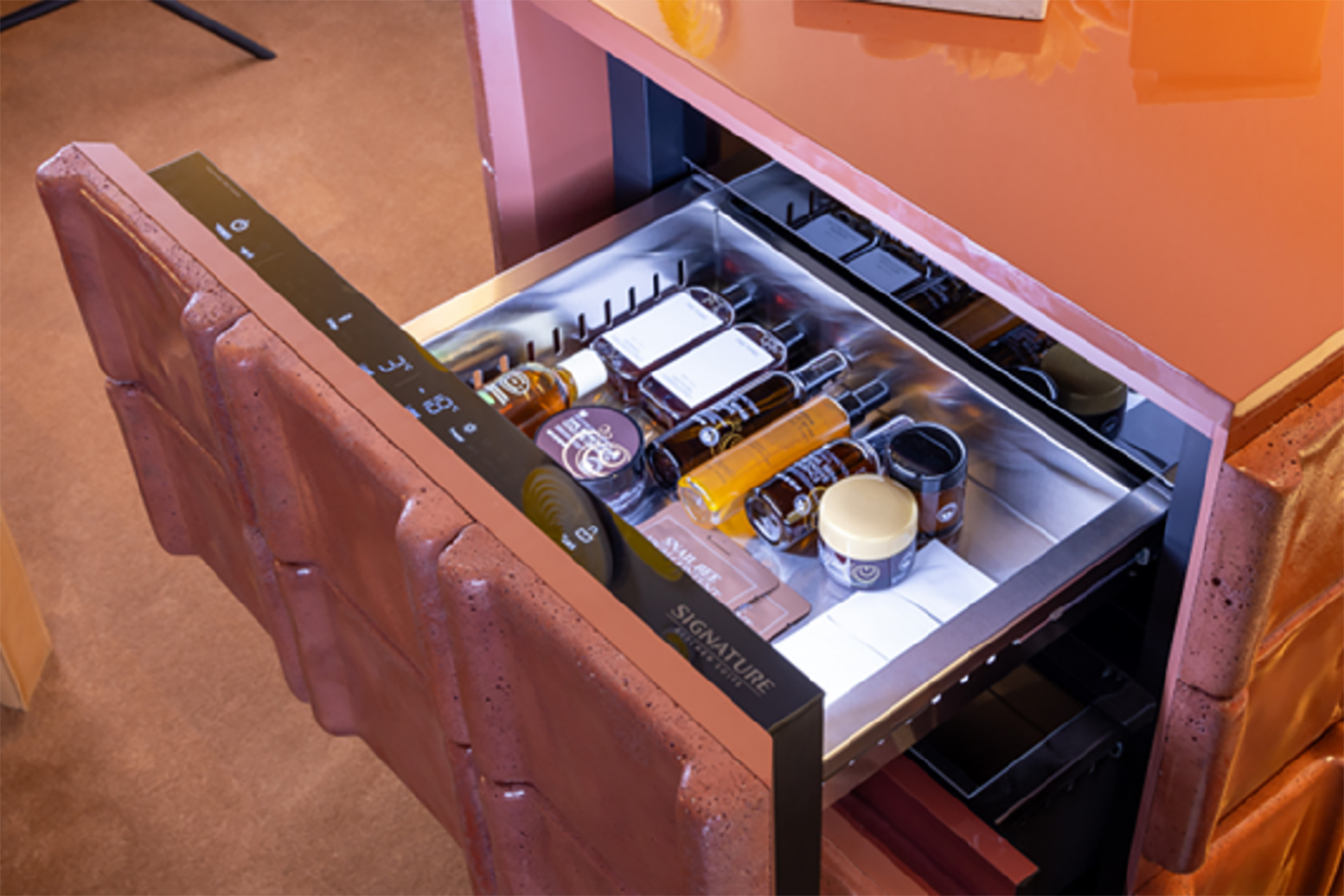 A picture of a modular refrigerator open with beverages inside