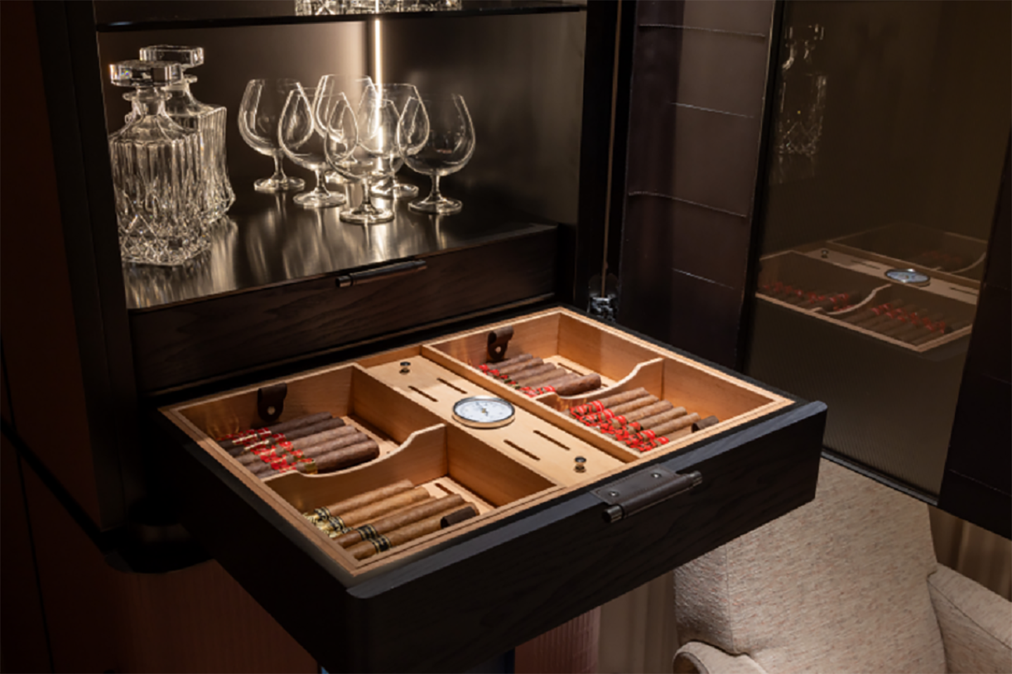 A picture of the wine cabin's drawer open with cigars
