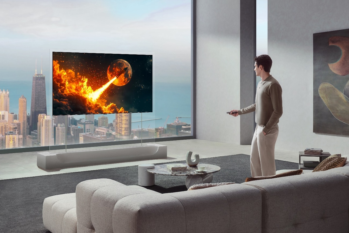 A man uses a remote to control an LG TV displaying a vivid rocket launch scene in a modern living room overlooking a city skyline.