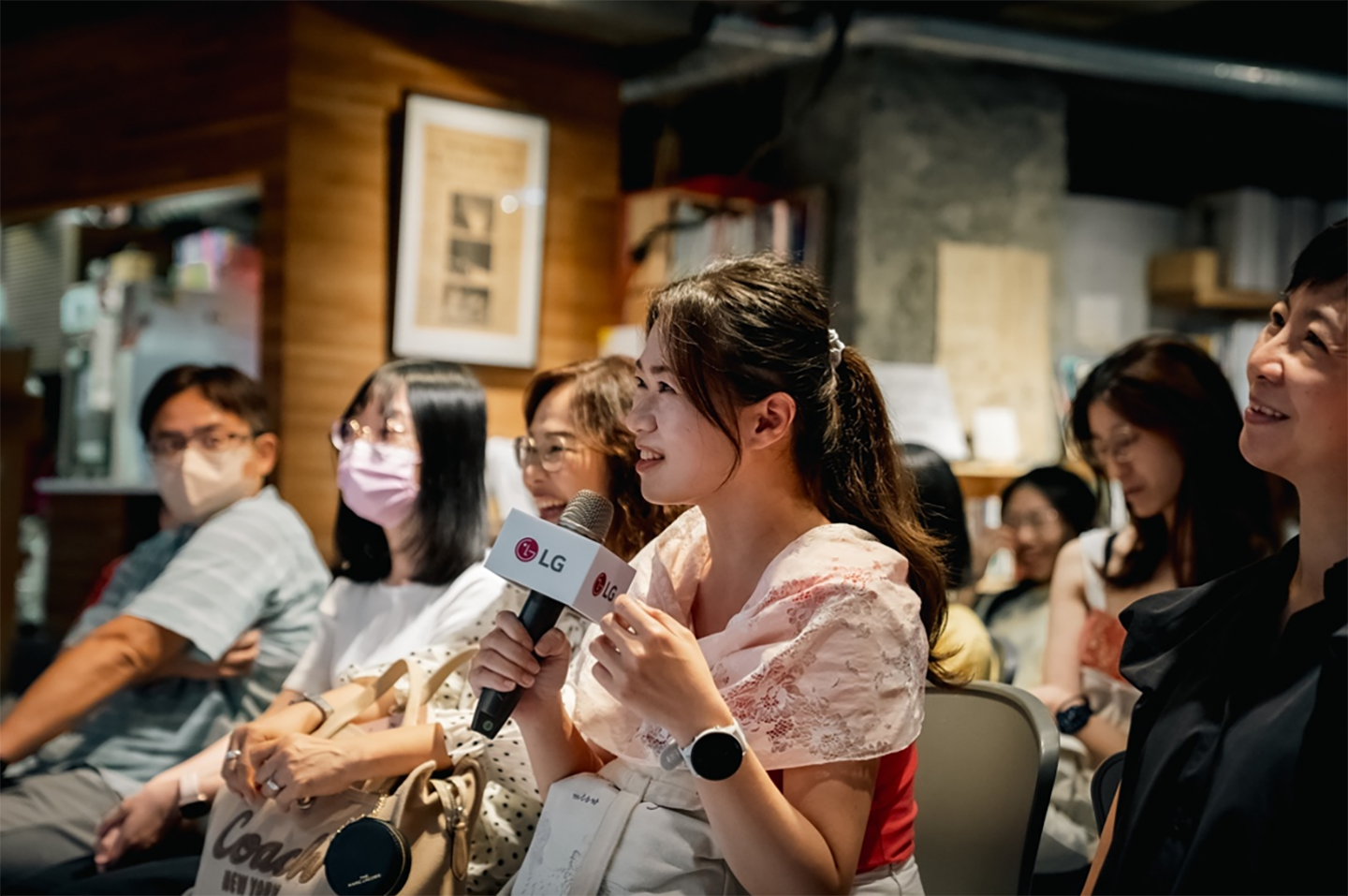 A picture of participants asking questions at the forum