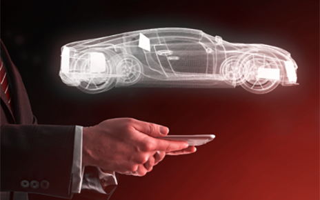 Image of a vehicle created above the human hand holding a smartphone