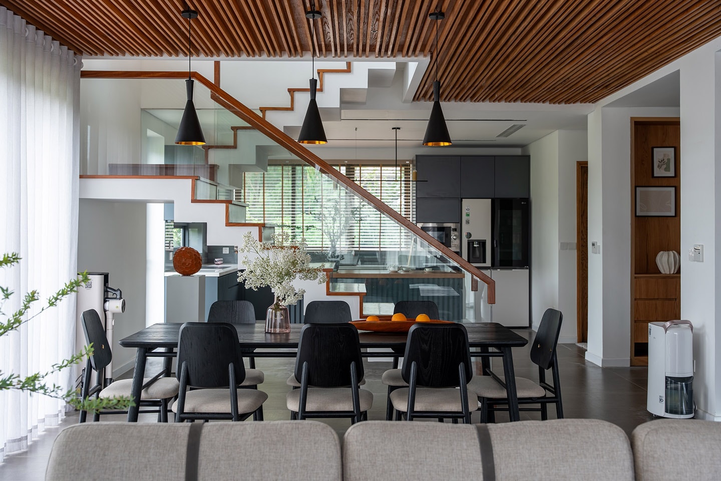 A picture of the dining table and the kitchen area of the LG Objet House