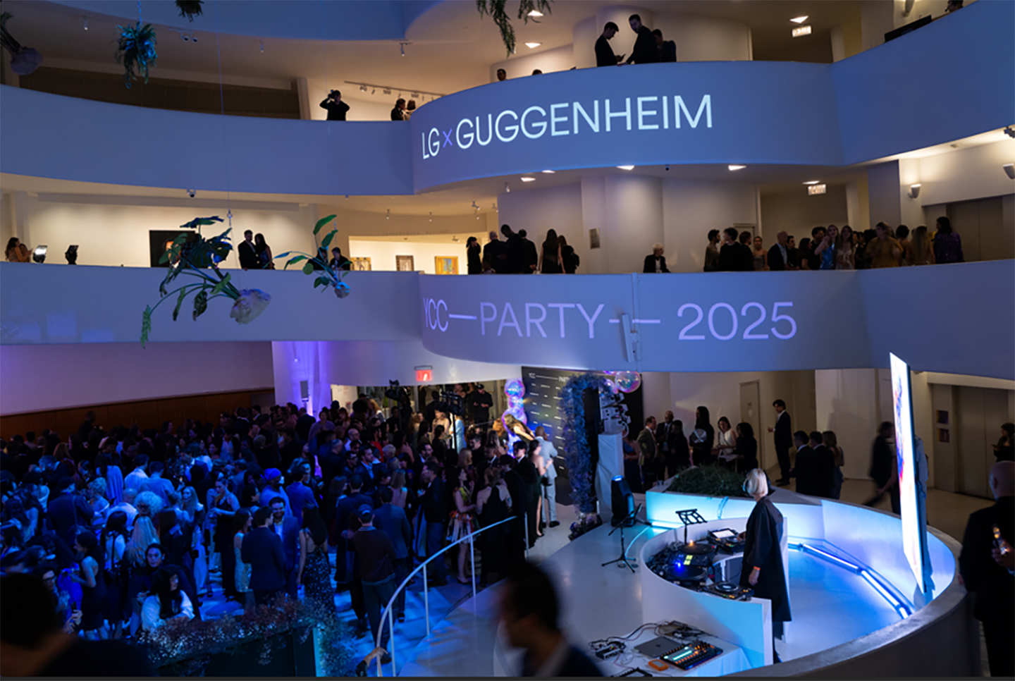 A photo indoors party with projection written 'LG x Guggenheim Party 2025'