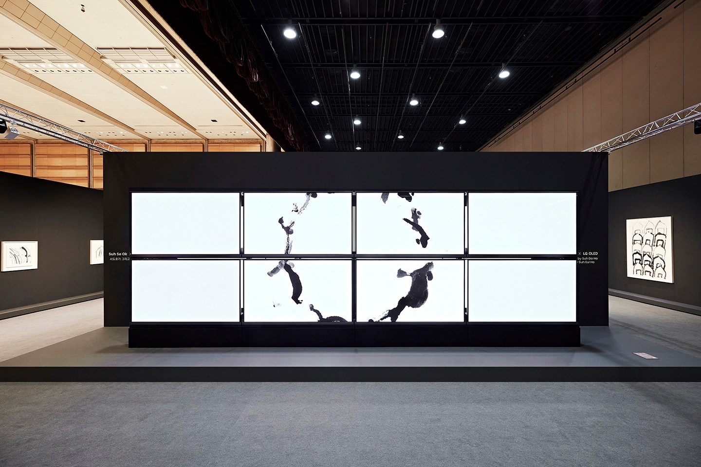 A picture of eight LG OLED screens displaying artwork
