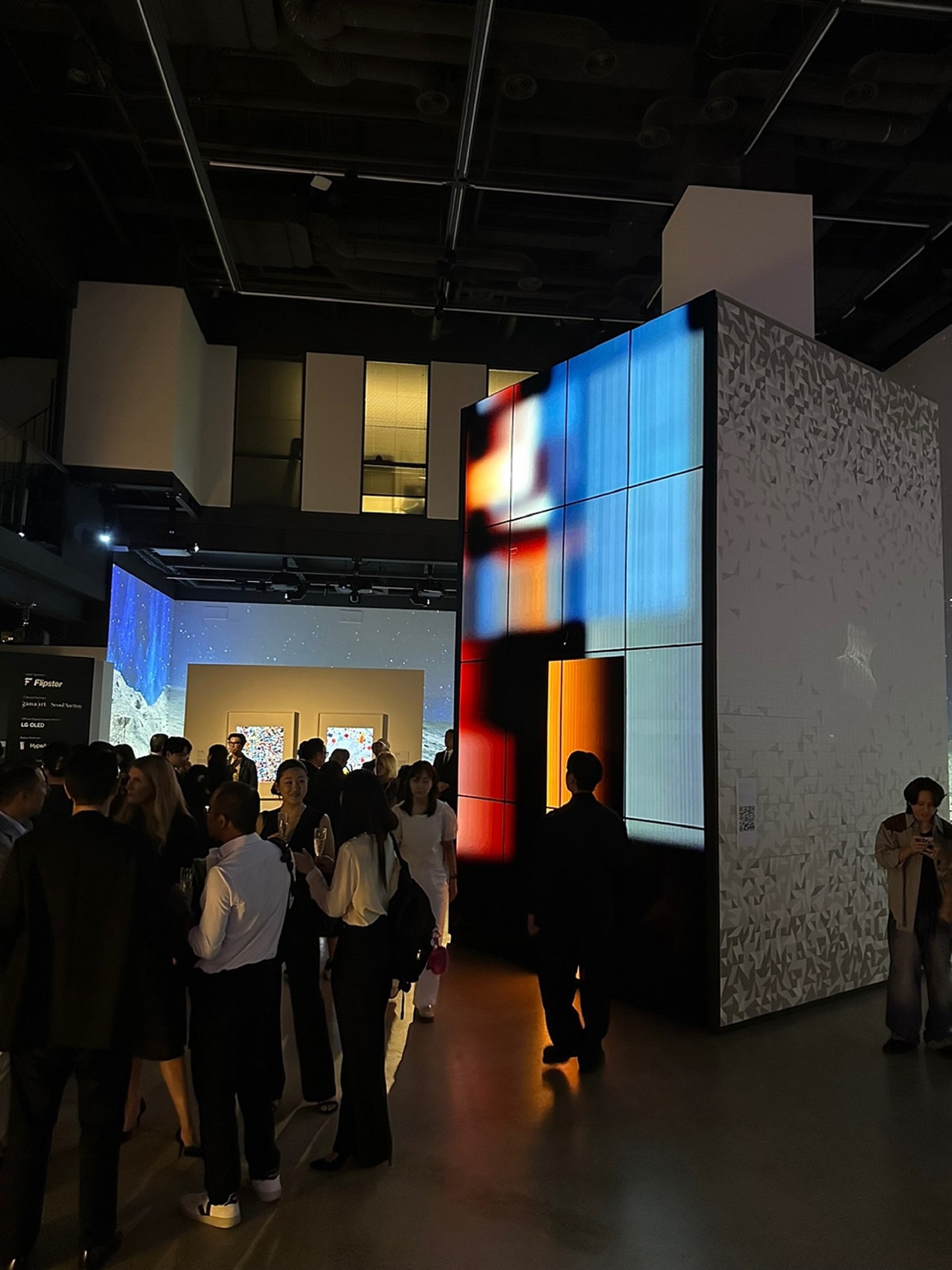 A picture of people at Frieze Seoul viewing the artwork