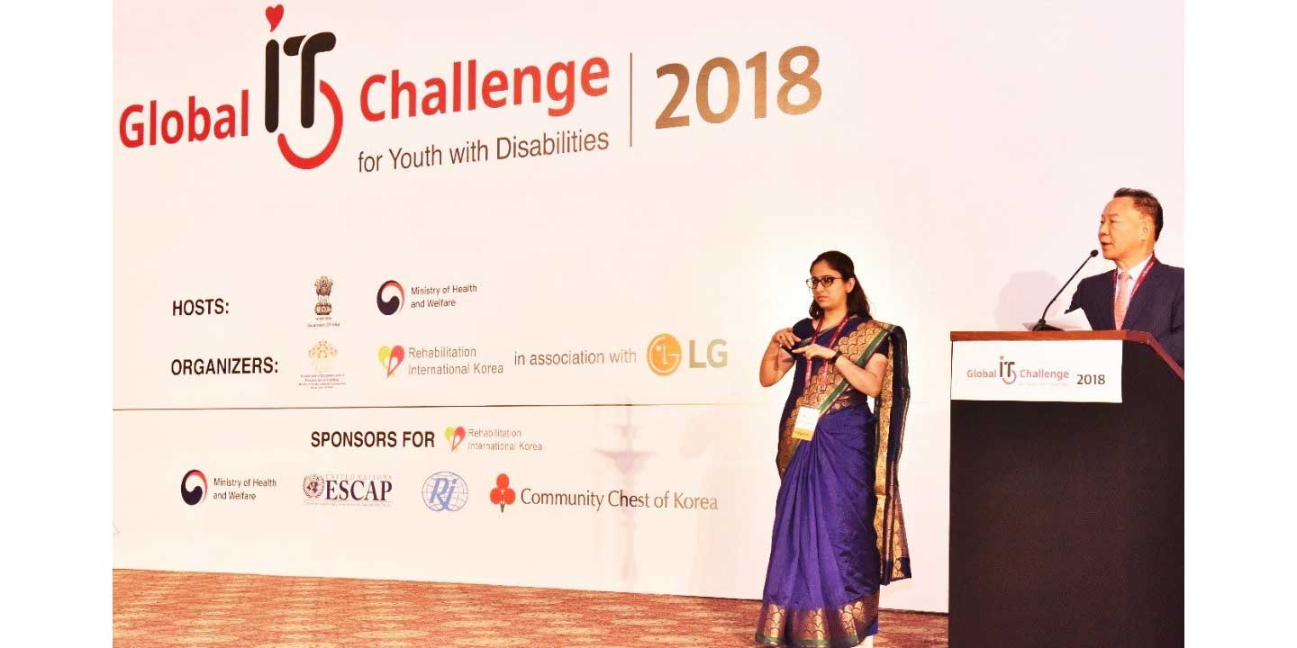Two presenters announce the start of the 8th Global IT Challenge for Youth with Disabilities on stage, which was sponsored by LG
