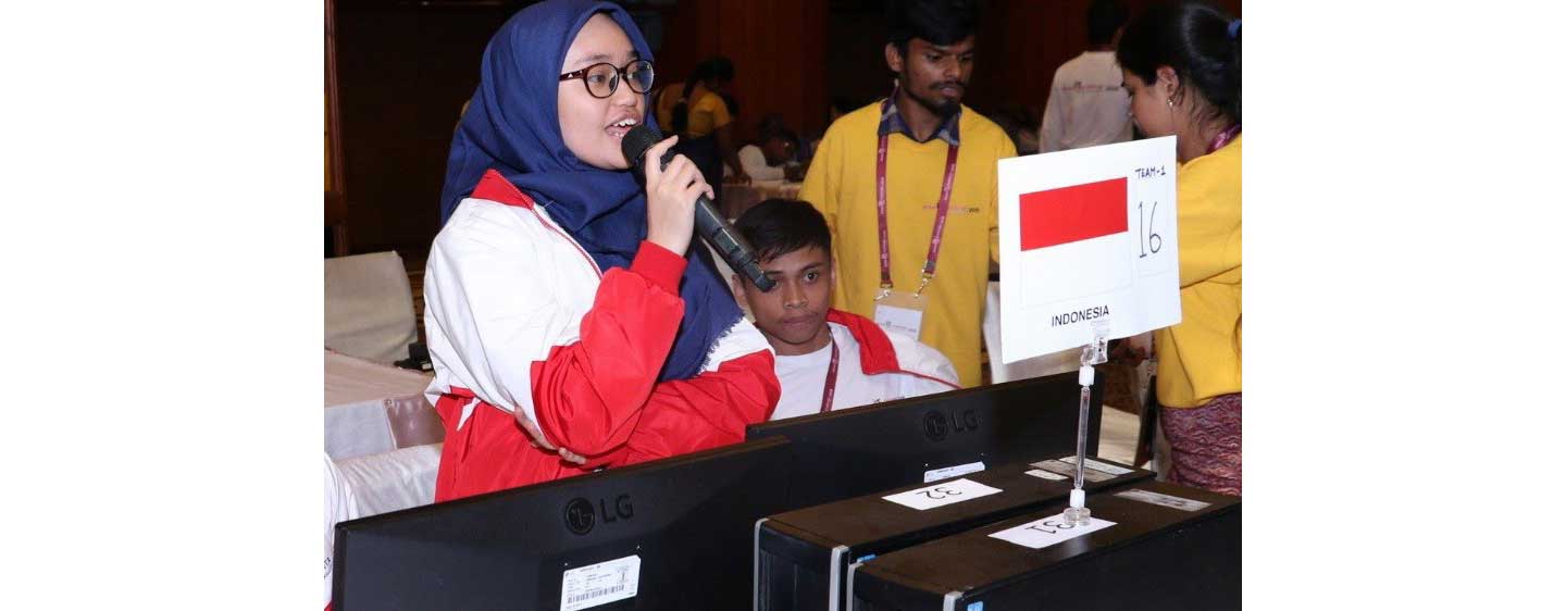 A couple of participants from Indonesia working on the monitors