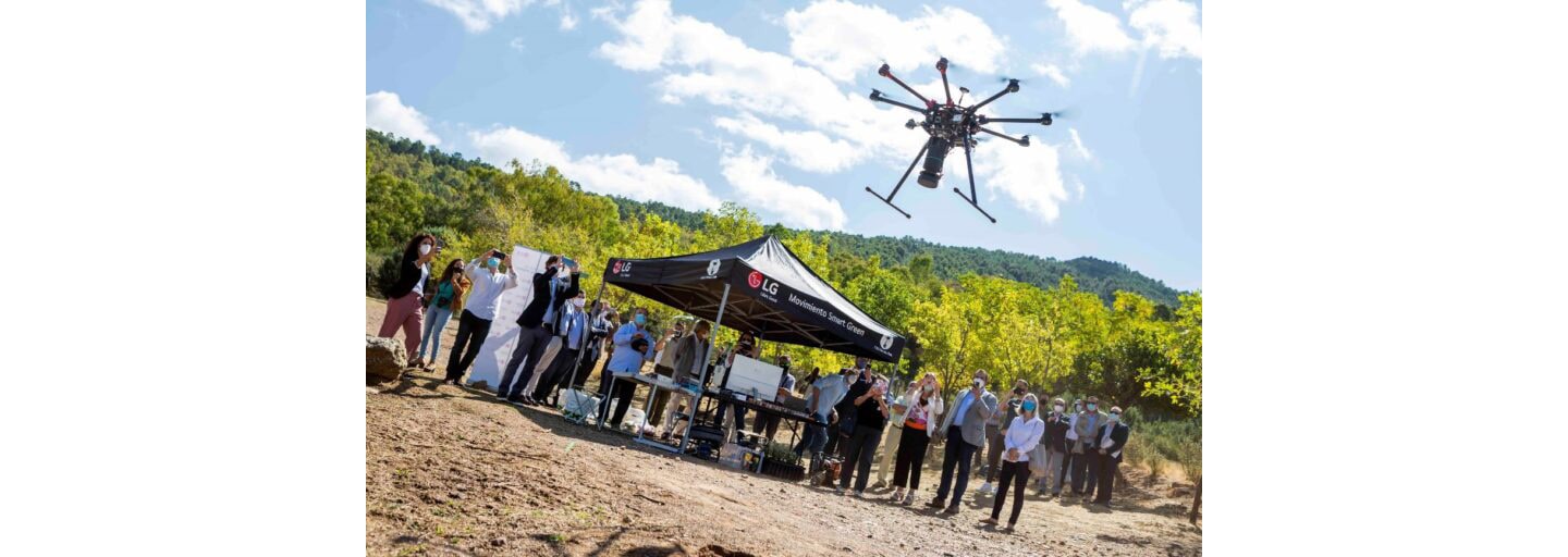 A drone flying around to gather information about the surrounding area that will help minimize the environmental impact and aid germination of the land.
