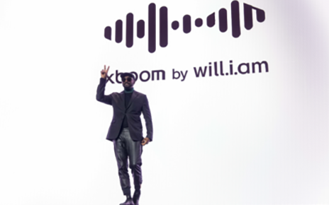 A photo of will.i.am smiling and posing during the LG World Premiere press conference at CES 2025