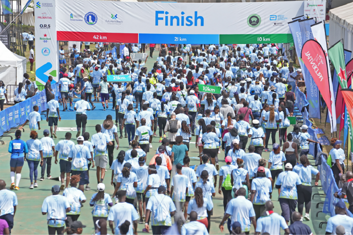 A photo of runners crossing the finish line at the Standard Chartered Nairobi Marathon