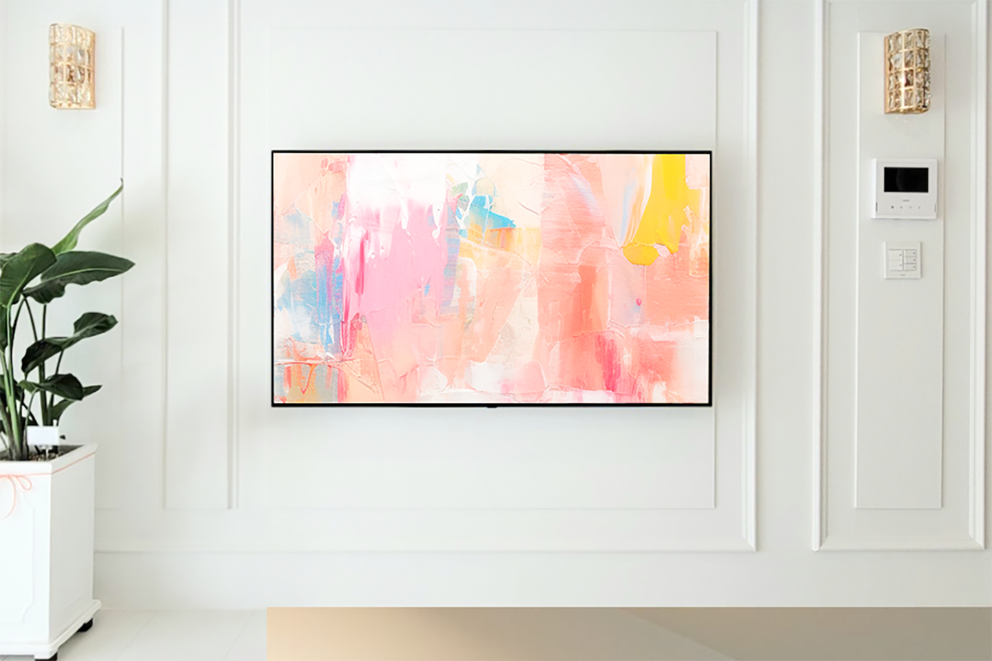 An image of an OLED TV in a home-like setting with artwork displayed on the screen