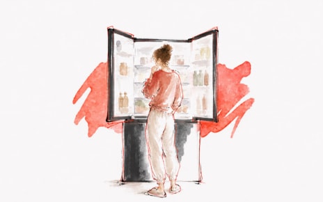 Watercolor and ink illustration on textured cream paper, wide horizontal crop, no text overlay. A woman with her hair in a bun, seen from behind in a coral pink top and cream pants, stands with hand to her chin looking into an open French-door refrigerator stocked with jars and bottles on every shelf. Bold splashes of coral-red watercolor fan out behind the refrigerator's base.