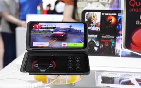 The new Dual Screen with the LG G8X ThinQ displays a racing game on the top screen and the game pad for racing games on the bottom screen respectively.