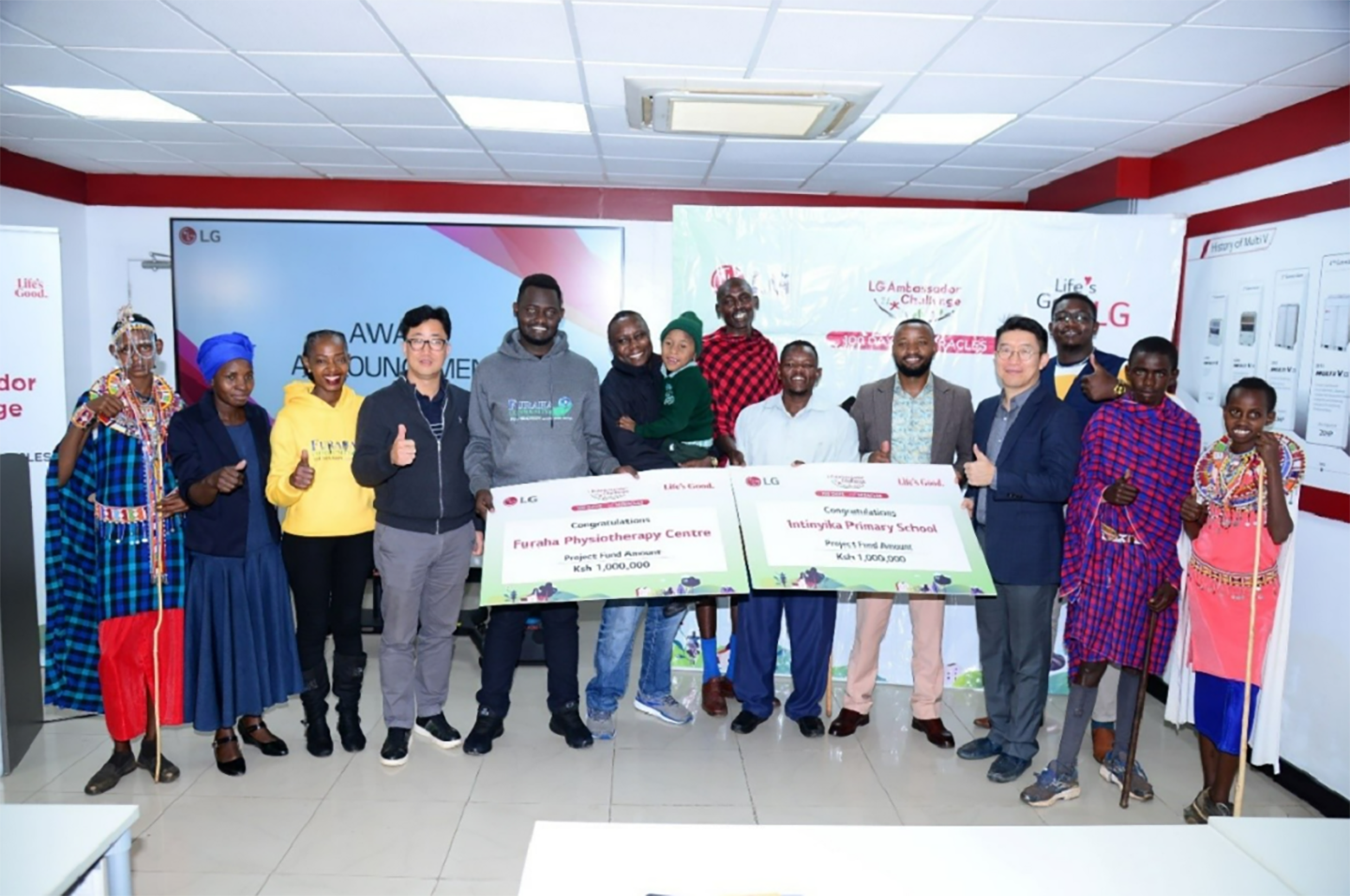 A picture of LG East Africa employees with people from Intinyika Primary school posing for a picture with the donation