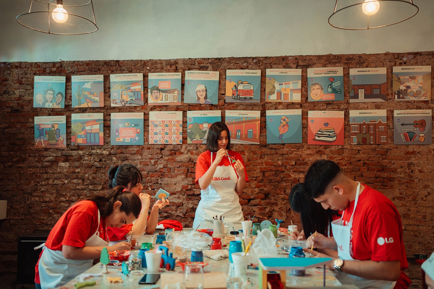 A photo of five LG employees painting toys to be gifted to local children in need