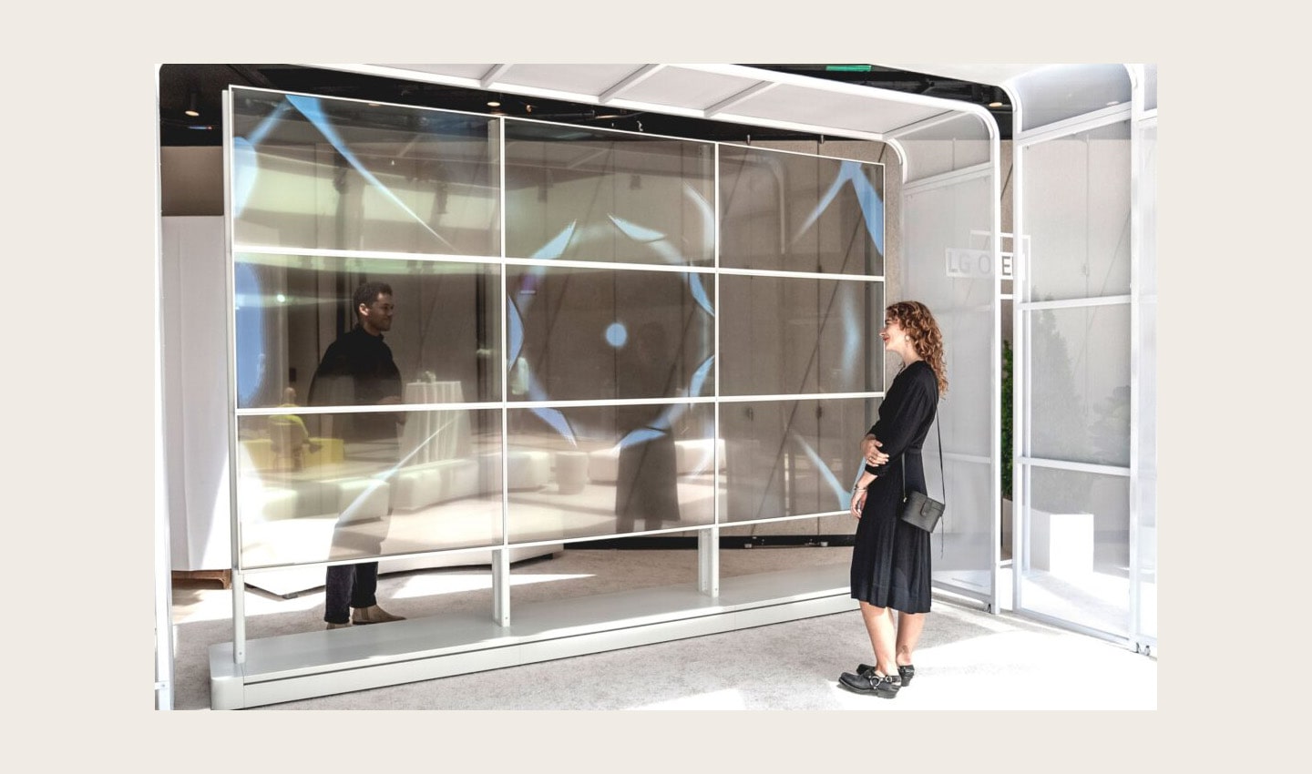 Two visitors viewing Kevin McCoy's work of art displayed on LG OLED TV