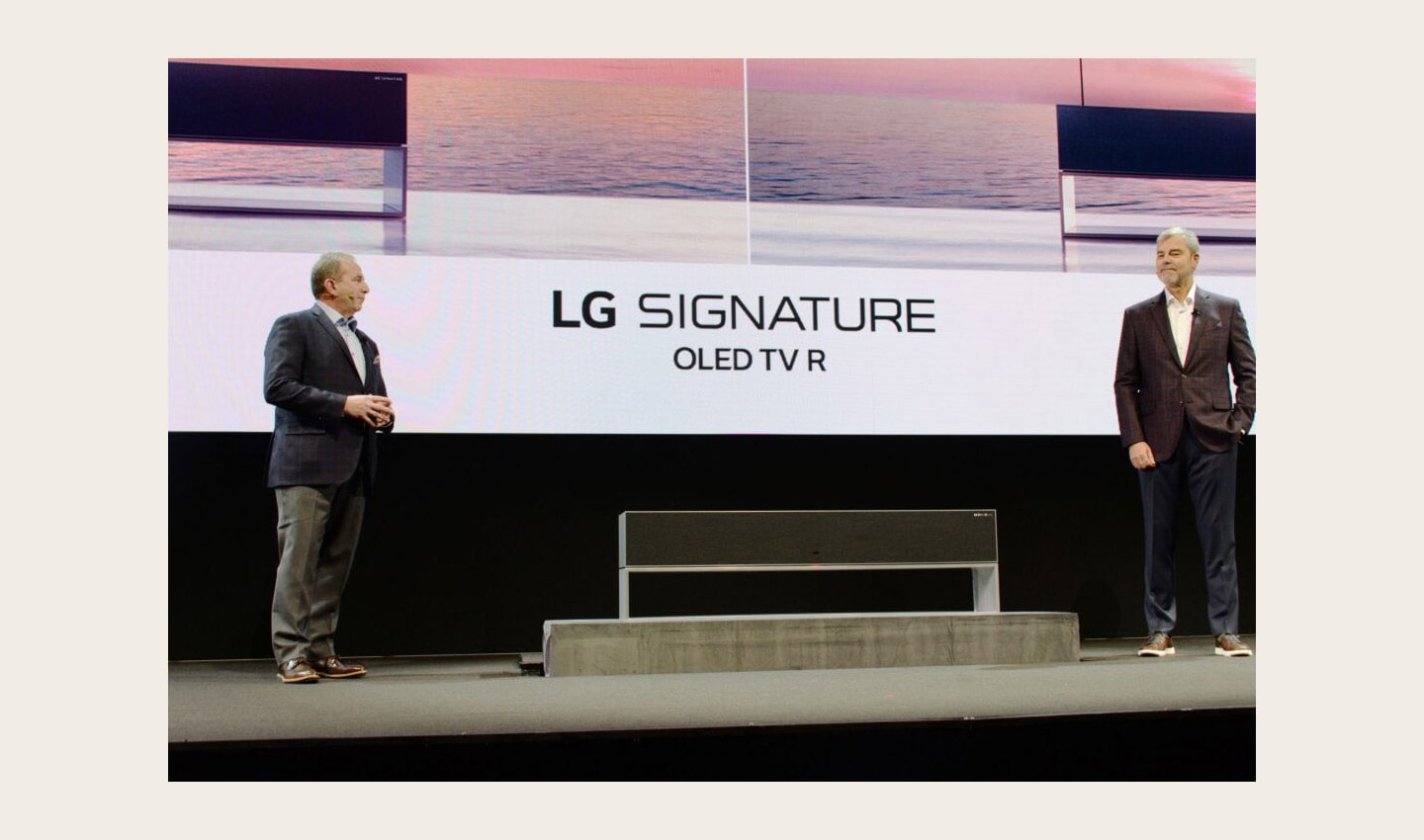 David VanderWall, Senior Vice President of Marketing at LG Electronics USA and Tim Alessi Senior Director of Product Marketing for Home Entertainment Products at LG Electronics USA introduce the LG SIGNATURE OLED TV R at LG's CES 2019 Press Conference while putting the TV between them.