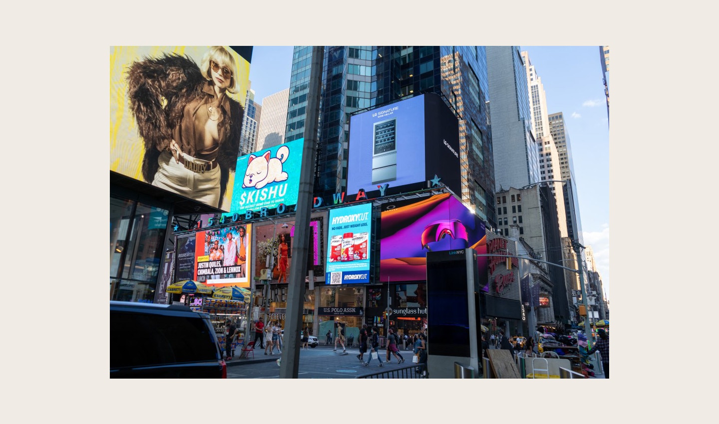 LG's digital billboard in Time Square, New York with an image of LG SIGNATURE Wine Cellar against a purple background