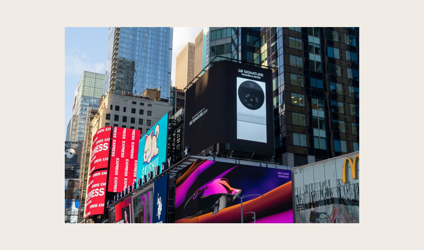 LG's digital billboard in Time Square, New York with an image of LG SIGNATURE Washer and Dryer against a black background