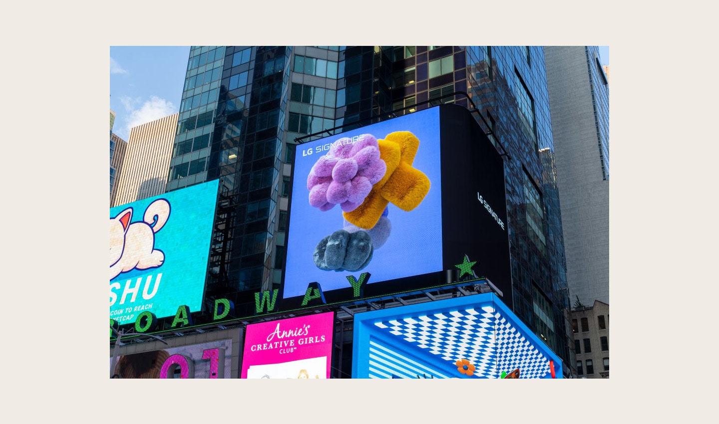 LG's digital billboard in Time Square, New York displaying an animation representing the function of LG SIGNATURE Washer and Dryer