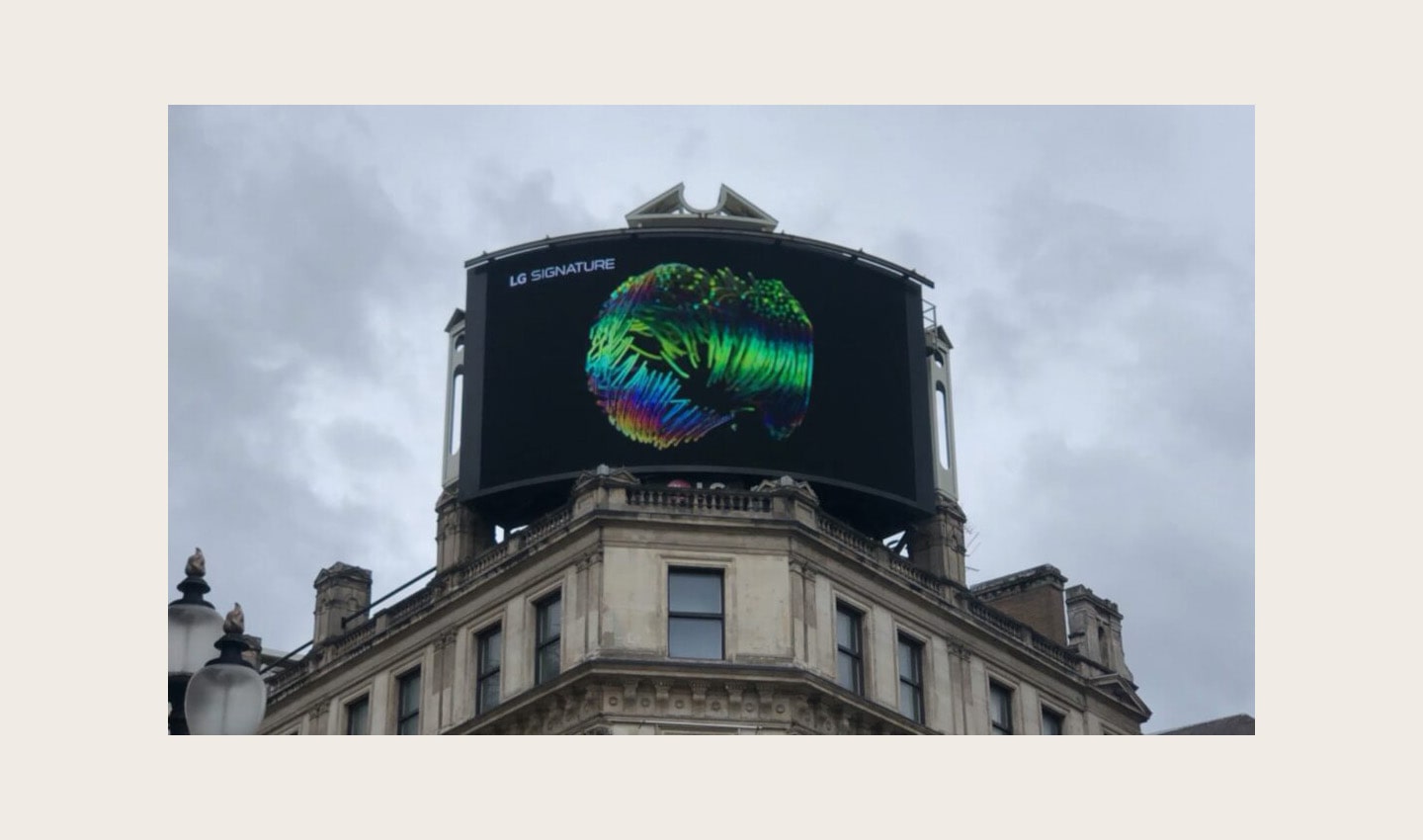 A close-up photo of LG's digital billboard in Piccadilly Circus, London with an animation representing LG SIGNATURE OLED R