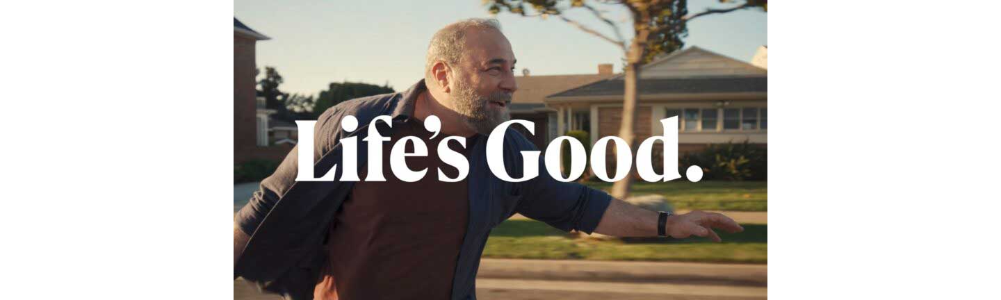 An image of a man riding a longboard with a phrase