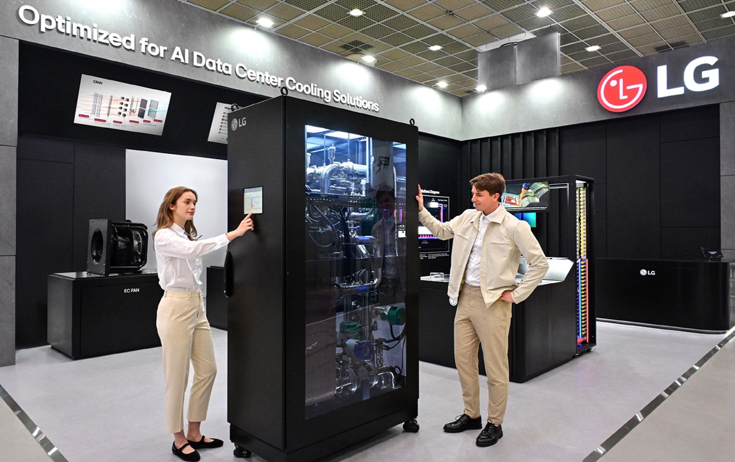 A photo of a man and woman showcasing LG’s Coolant Distribution Unit at DCW 2025