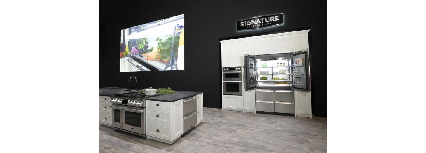 Signature Kitchen Suite built-in French Door refrigerator is displayed with other kitchen appliances in the LG booth at Kitchen and Bath Industry Show 2022