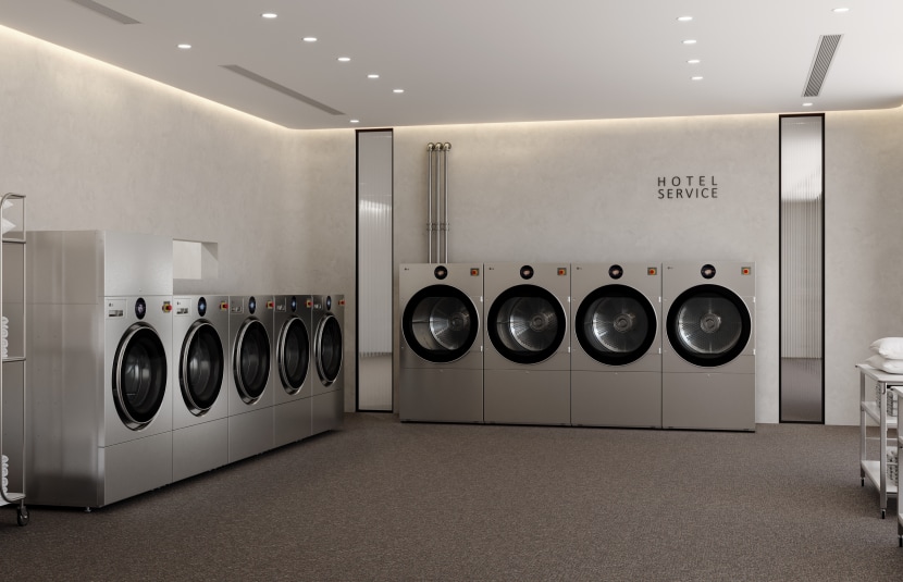 A modern hotel laundry room features, from left to right, one LG Professional WasherDryer unit, four LG Professional Washer units and four LG Professional Dryer units, with utility carts holding folded towels nearby and a “HOTEL SERVICE” sign on the wall above the dryer units.