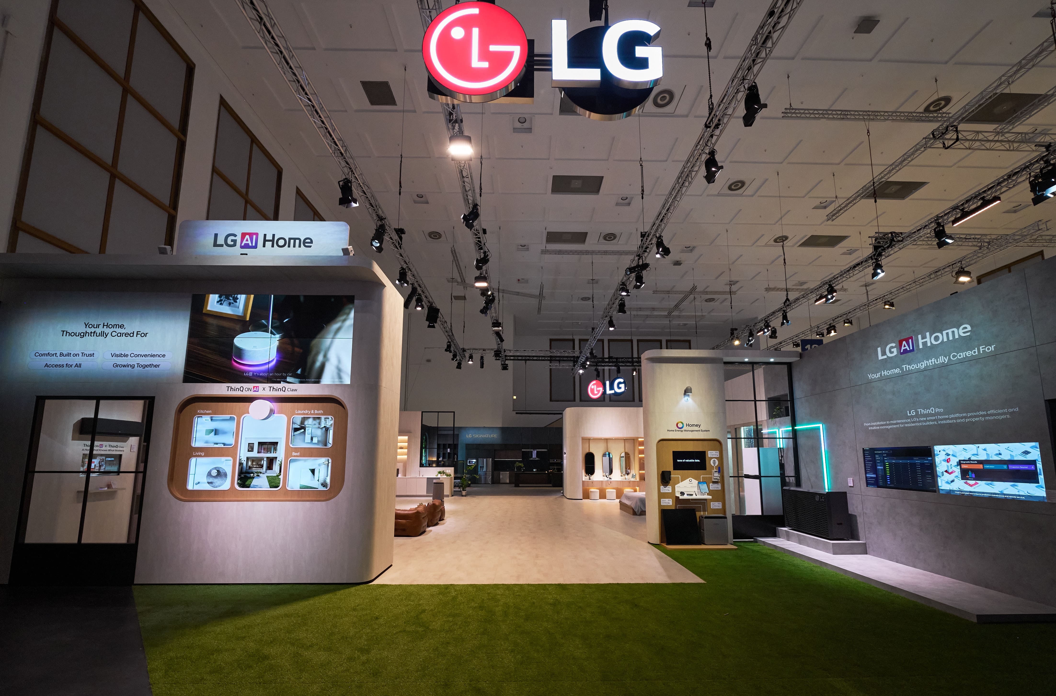 The expansive LG AI Home exhibition space at IFA 2026 featuring various interactive smart living booths, centered around the new LG ThinQ ON AI home hub on display.