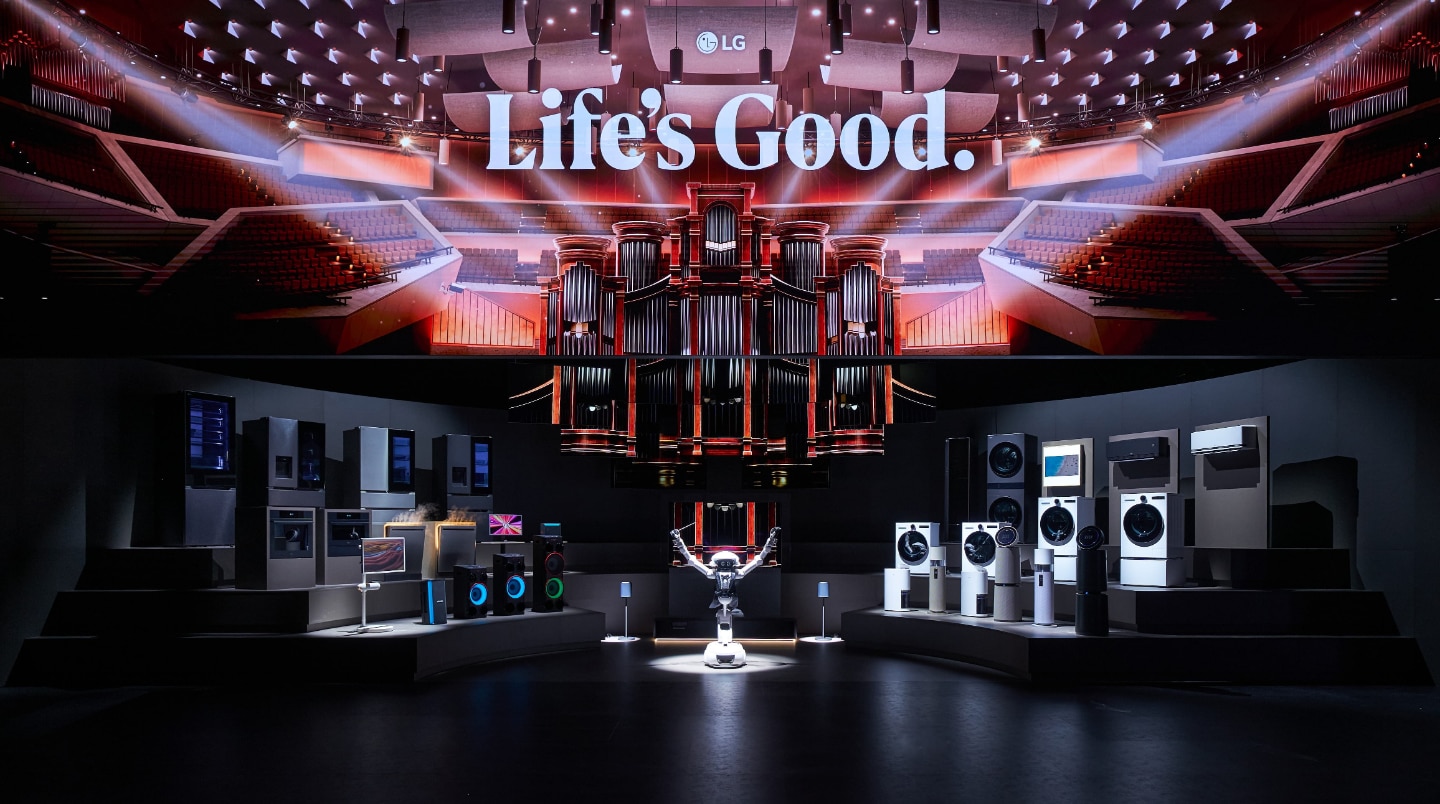The LG AI Orchestra installation at IFA 2026 featuring a connected ecosystem of home appliances on a tiered stage, with an LG CLOiD robot acting as a conductor beneath a massive LED pipe organ screen.