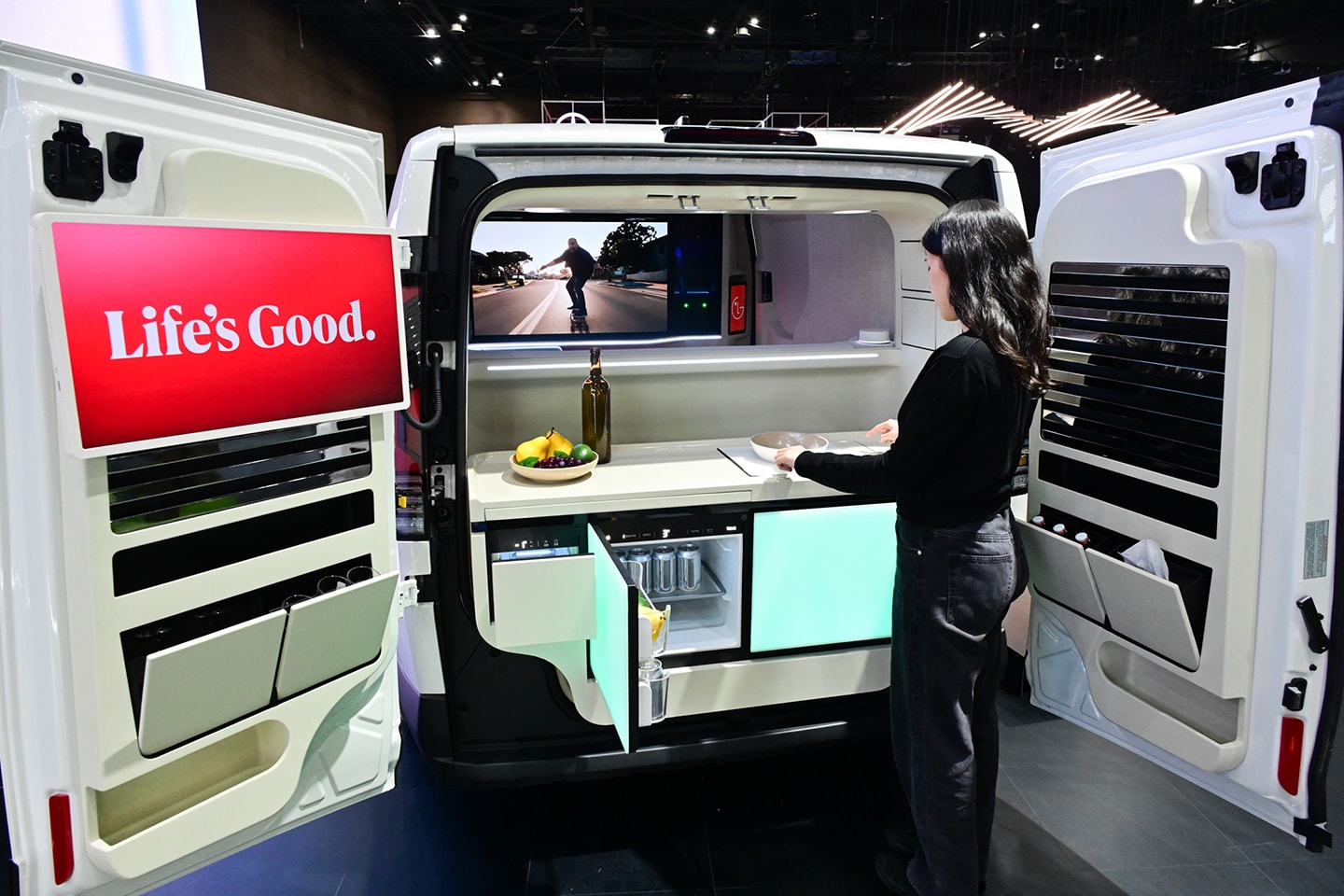 A photo of a woman experiencing the Spielraum concept car at the 2025 Seoul Mobility show