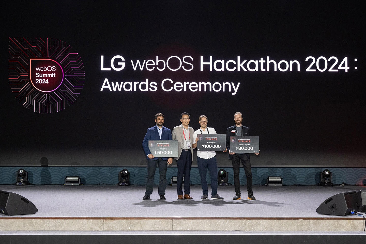 Chris Jo, senior vice president of platform business at LG Home Entertainment Company, poses for a photo alongside the winners of the LG webOS Hackathon 2024