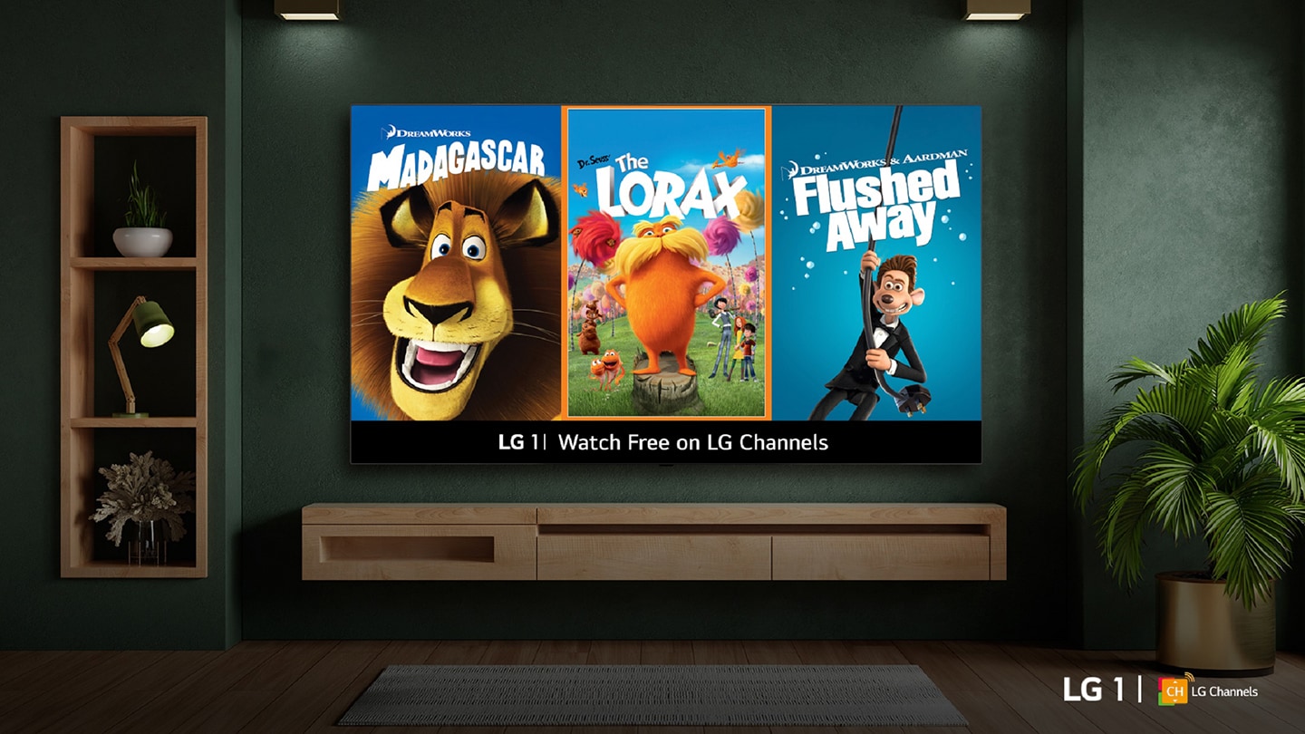 A wall-mounted LG smart TV in a cozy living room displays posters from newly added animated movies on LG 1, including Madagascar, The Lorax and Flushed Away