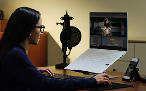 A woman is watching content displayed on the screen from the new LG gram 16 Pro