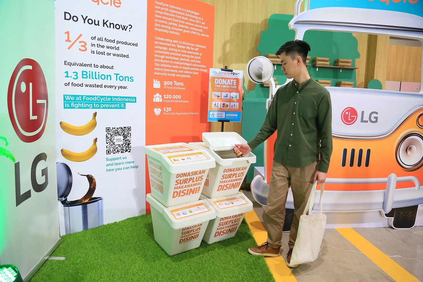 a photo of man donating food at a booth 