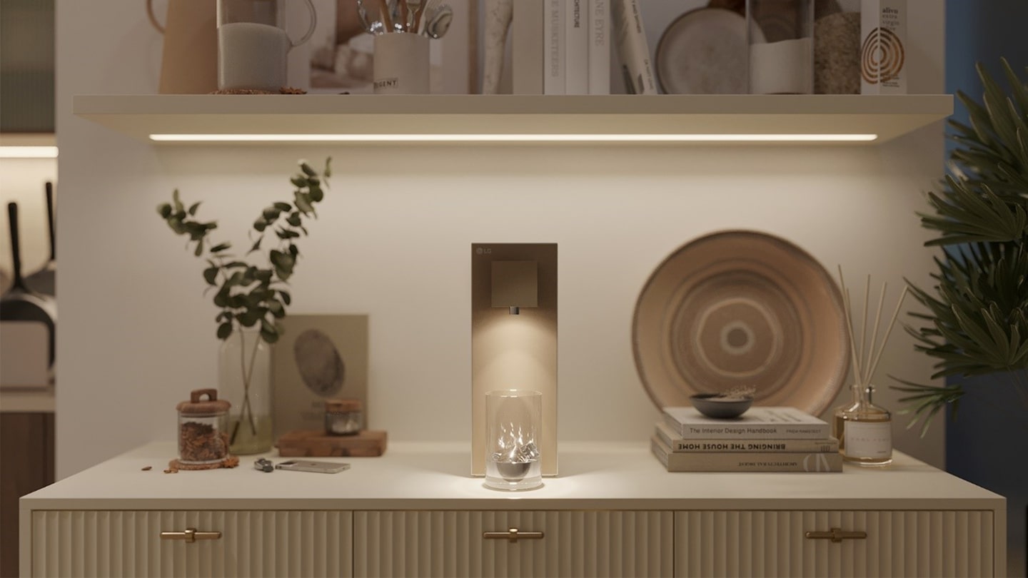 A picture of a table with the LG PuriCare and different objects next to it