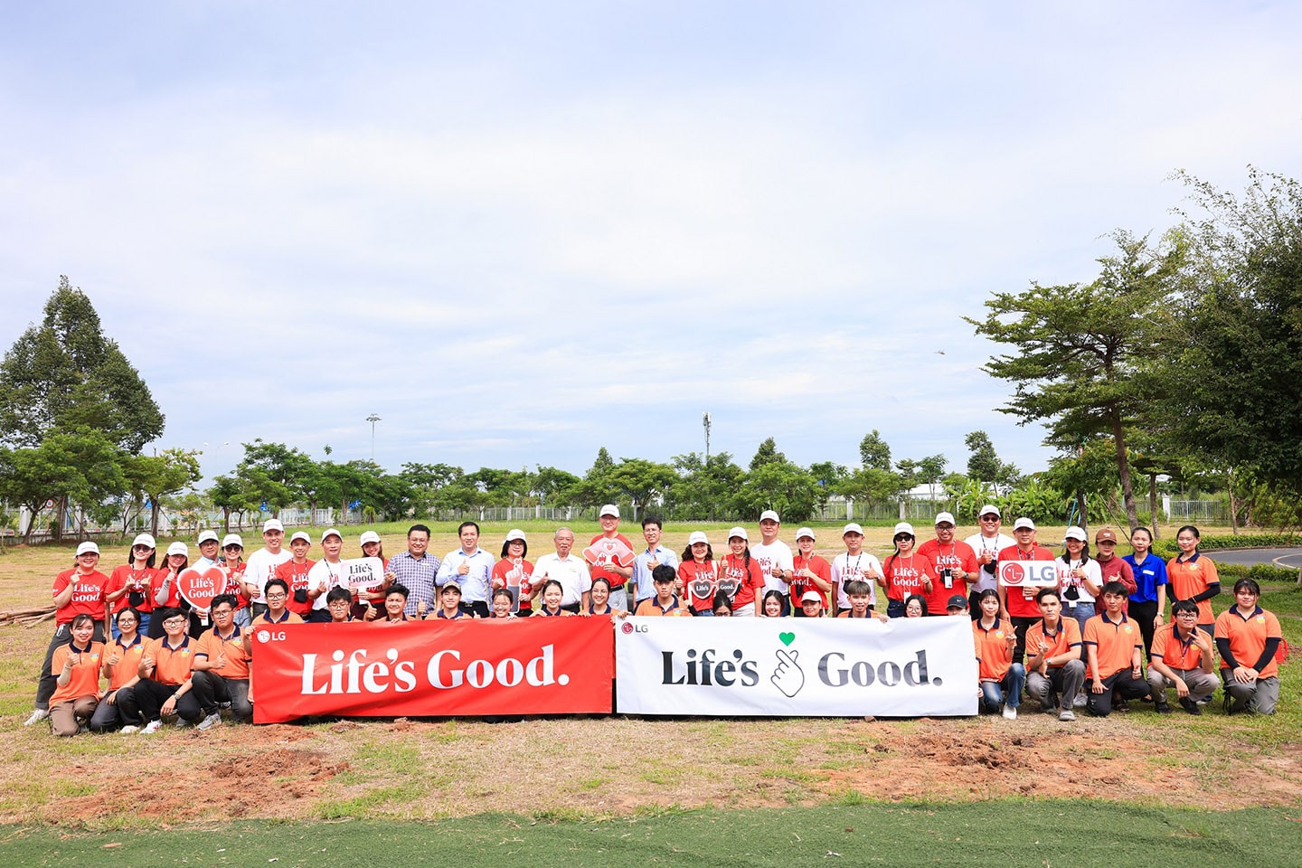 A group picture of LG Vietnam employees holding a Life's Good slogan sign