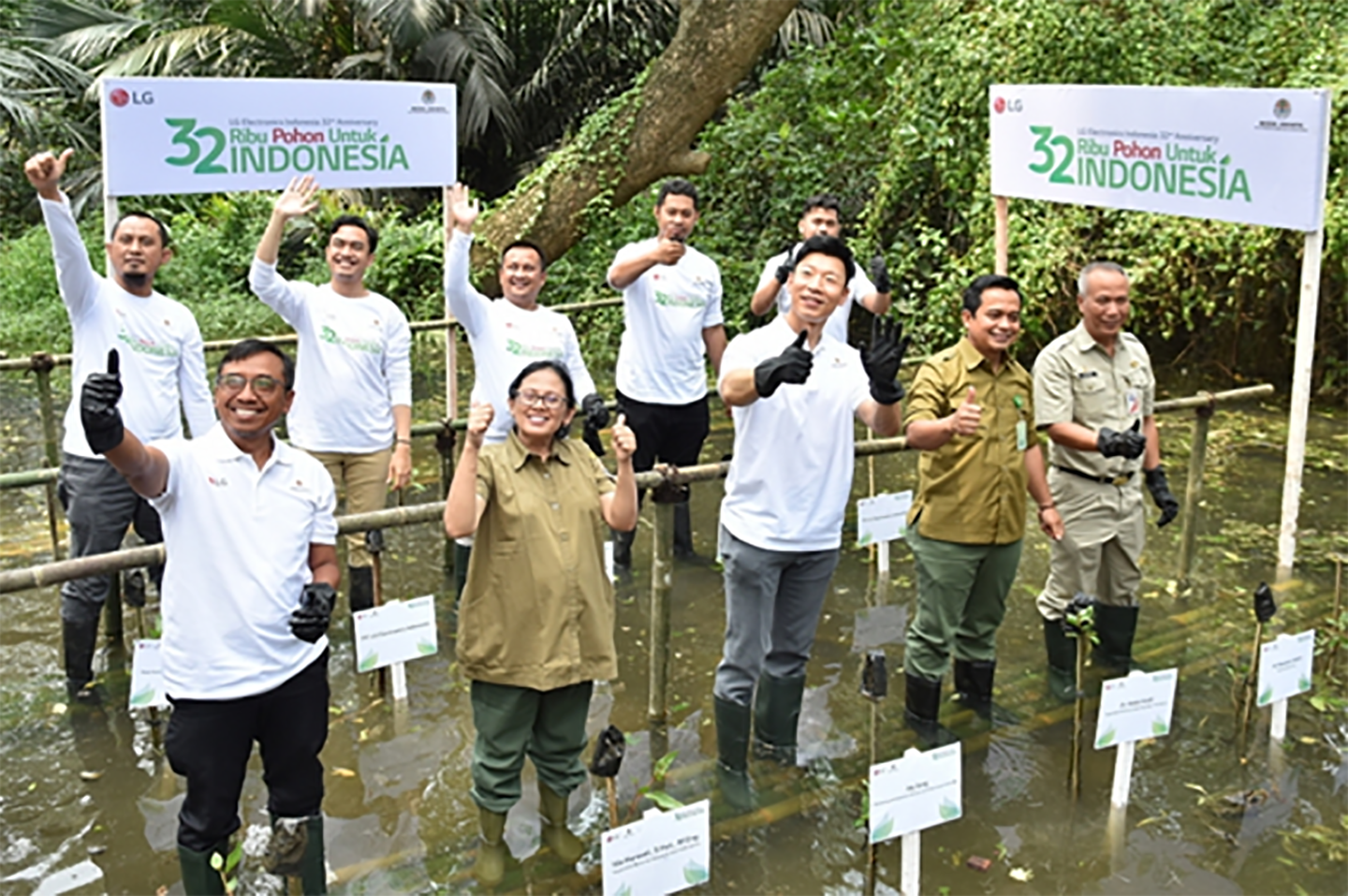 An image of people smiling during the planting trees campaign in India
