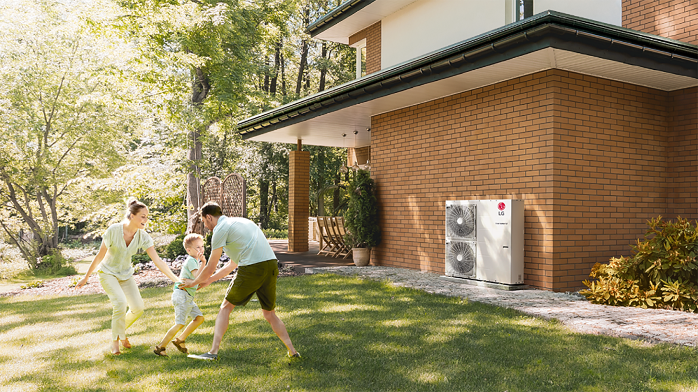 An image of a mom, dad, and child playing in their front yard 