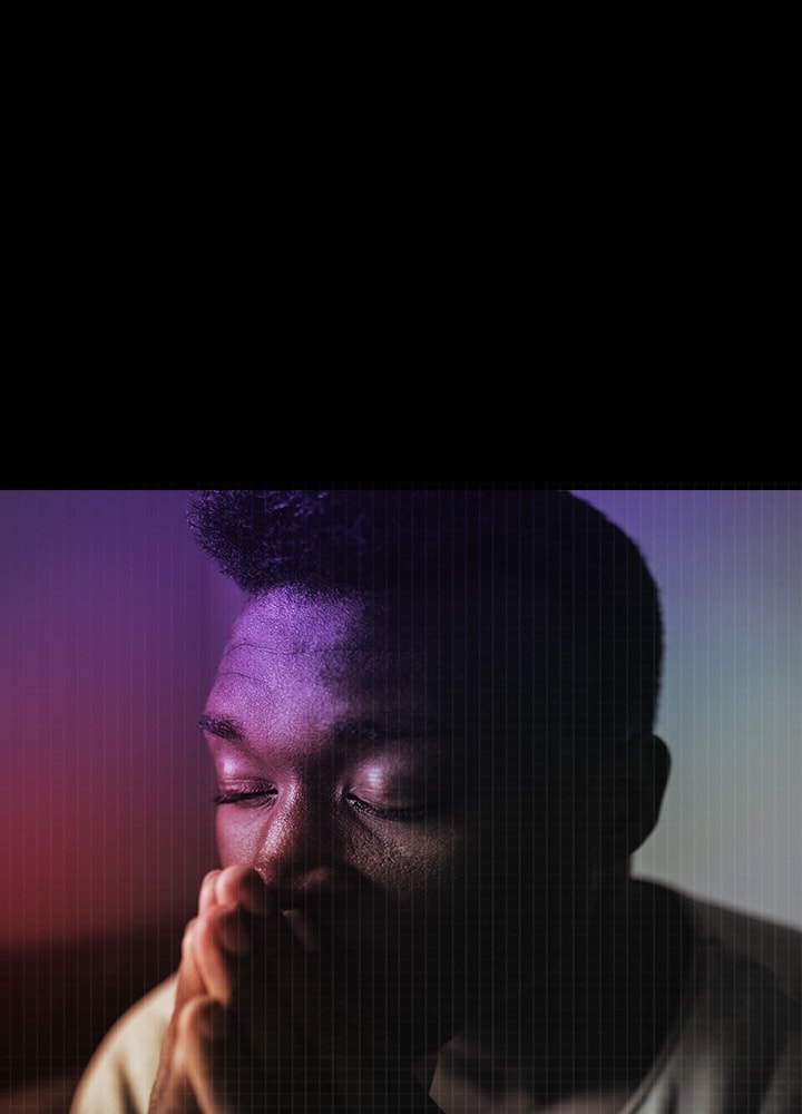 A man with closed eyes and a sad expression in a cool blue space with a gritty and atmospheric vibe.