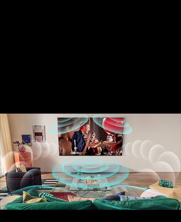 圖片顯示房間內 LG OLED 電視的影像正在播放一場音樂會。描繪虛擬環迴立體聲的氣泡充滿了整個空間。