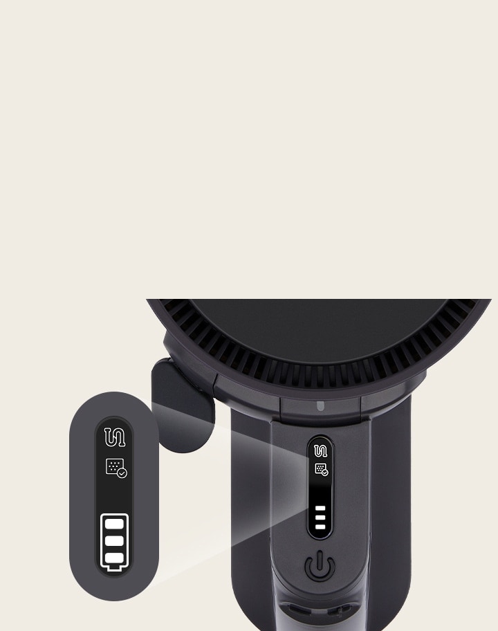 LG 吸塵機的頂視圖，顯示控制面板上的電量和模式指示器。