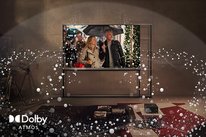 客廳牆上掛著 LG OLED TV，電視發射出抽象圓圈，填滿整個空間。