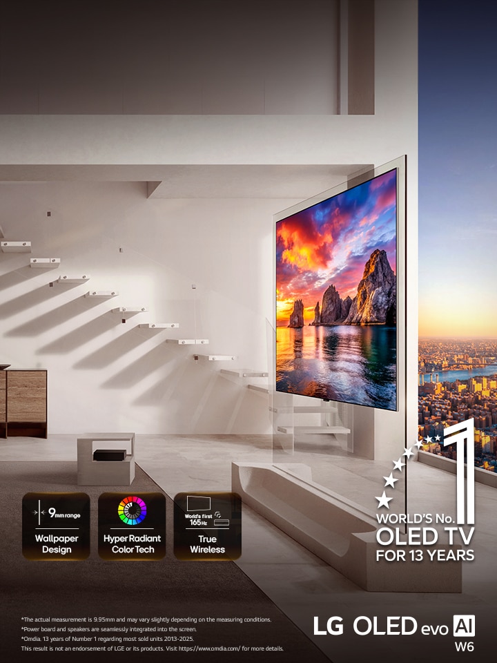 LG OLED evo AI W6 Wallpaper TV is installed in a living room with city views, showing a vivid sunset coastal scene with on-screen icons reading “9mm-class thin Wallpaper Design,” “Hyper Radiant Color Tech,” and “World’s First 165Hz True Wireless.”