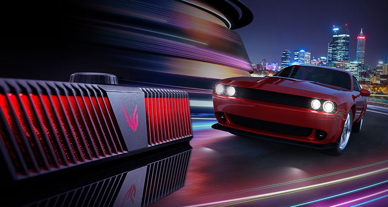 A left sided diagonal view of gaming speaker and there is a racing car coming through from behind.